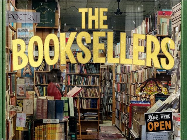 A shop window with The Booksellers written in yellow writing