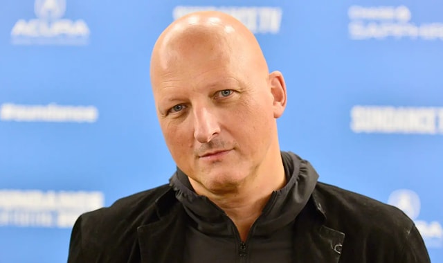 Dan Reed looks at the camera